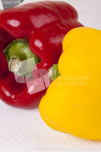 Image of Red and Yellow Peppers on White Background