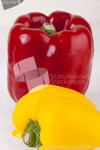 Image of Red and Yellow Peppers on White Background