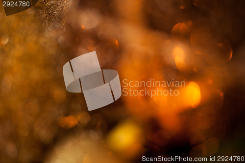 Image of Warm gold and red Christmas candlelight background