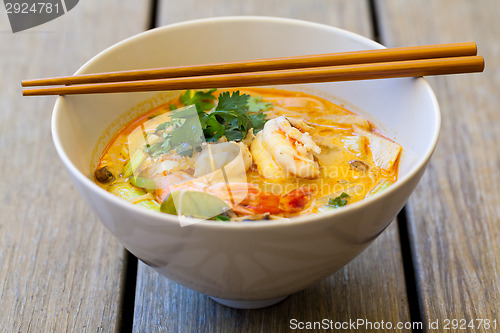 Image of Bowl of traditional Thai tom yam soup