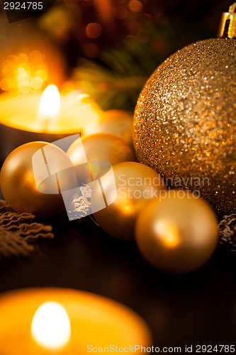 Image of Warm gold and red Christmas candlelight background