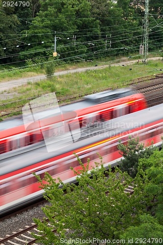 Image of Fast moving train with red stripe