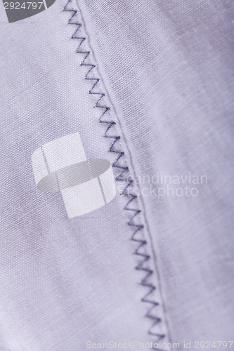 Image of Closeup Small Buttons on White Cloth