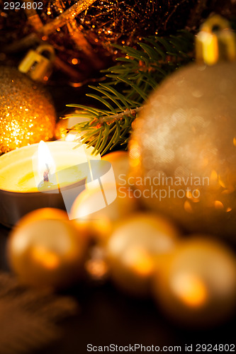 Image of Warm gold and red Christmas candlelight background