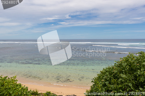 Image of Beautiful tropical beach with lush vegetation