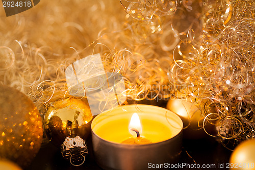 Image of Warm gold and red Christmas candlelight background