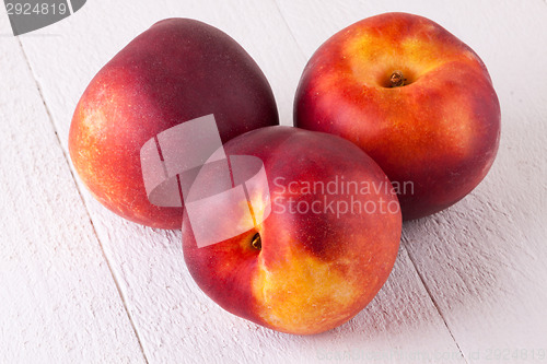 Image of Three tasty fresh ripe juicy nectarines