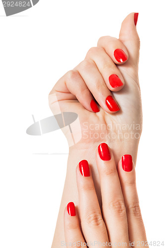 Image of Woman with beautiful manicured red fingernails