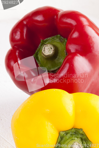 Image of Red and Yellow Peppers on White Background