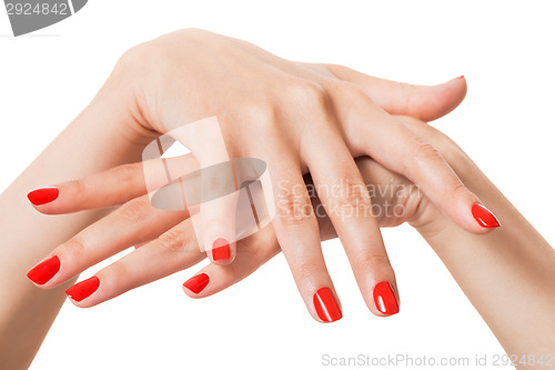 Image of Woman with beautiful manicured red fingernails