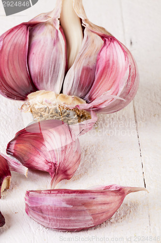 Image of Fresh garlic bulb with loose cloves