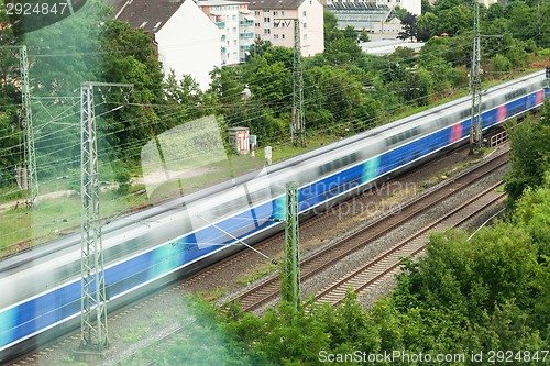 Image of Fast moving train with red stripe