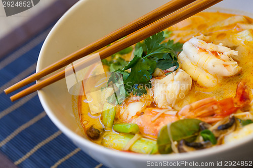 Image of Bowl of traditional Thai tom yam soup