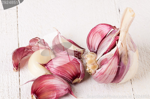 Image of Fresh garlic bulb with loose cloves