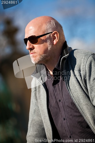 Image of Stylish man in sunglasses enjoying the sun