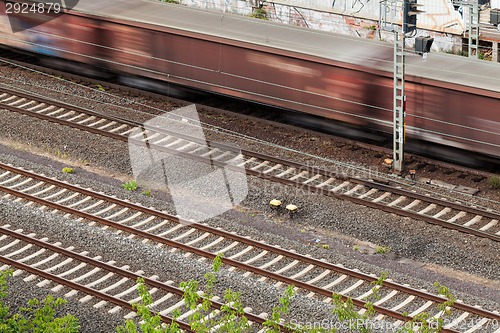 Image of Fast moving train with red stripe