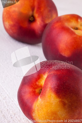 Image of Three tasty fresh ripe juicy nectarines