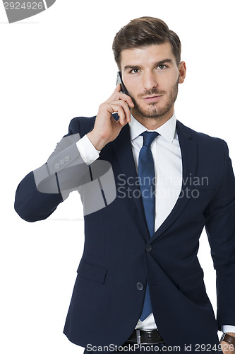 Image of Stylish businessman chatting on his mobile