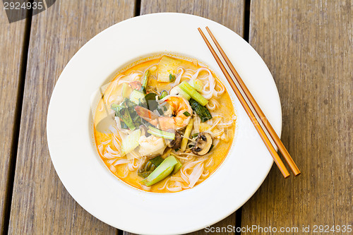 Image of Bowl of traditional Thai tom yam soup