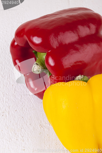 Image of Red and Yellow Peppers on White Background