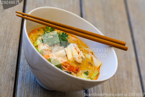 Image of Bowl of traditional Thai tom yam soup