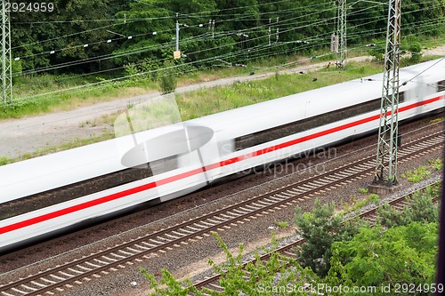 Image of Fast moving train with red stripe