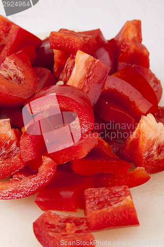 Image of Pile of Chopped Red Pepper on Cutting Board