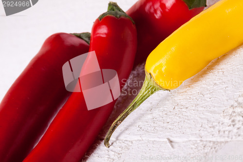 Image of Fresh red and yellow chili peppers with spice