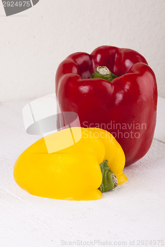 Image of Red and Yellow Peppers on White Background