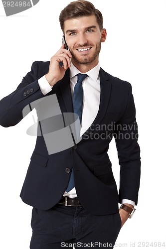 Image of Stylish businessman chatting on his mobile