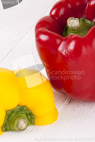 Image of Red and Yellow Peppers on White Background