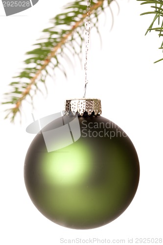 Image of Christmas ball hanging from a branch of a fir tree