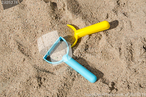 Image of Toys in a sandbox closeup