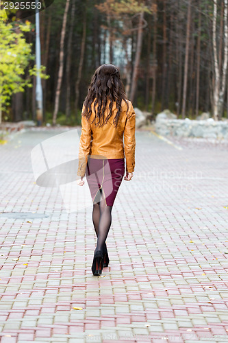 Image of girl goes through the alley