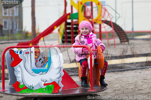 Image of girl on the carousel