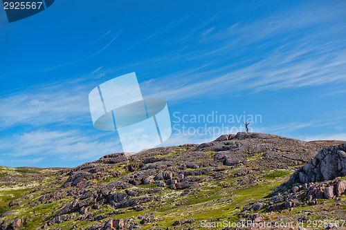 Image of Man with a backpack on a mountain