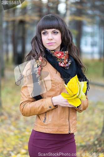 Image of Portrait of a beautiful girl in the autumn forest