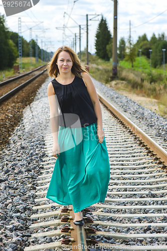 Image of Walking girl on the railway