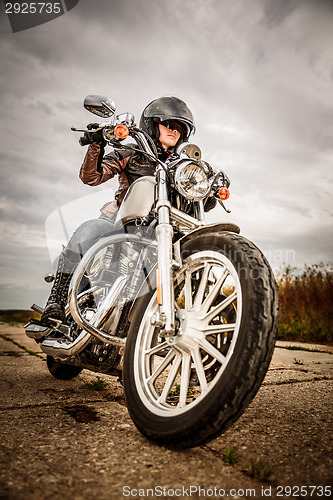 Image of Biker girl on a motorcycle