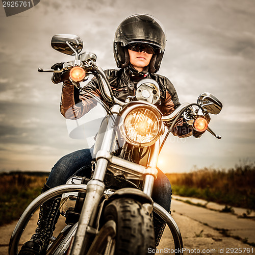 Image of Biker girl on a motorcycle