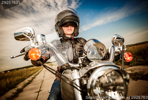 Image of Biker girl on a motorcycle