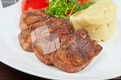 Image of tongue with grilled vegetable