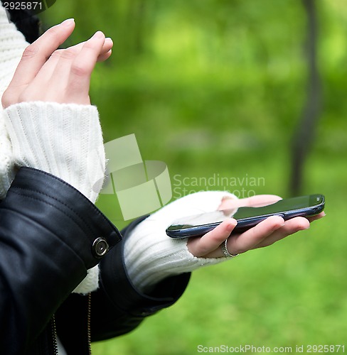 Image of hands with phone