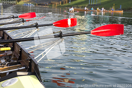 Image of Boat with a red paddle