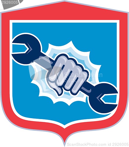 Image of Mechanic Hand Holding Spanner Shield Punching 