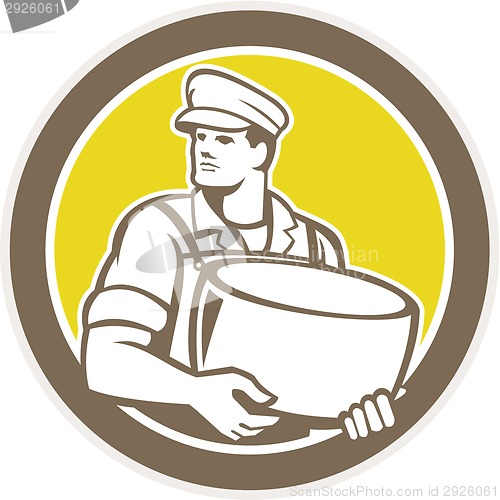 Image of Cheesemaker Holding Parmesan Cheese Circle