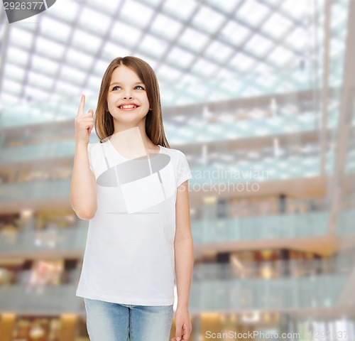 Image of smiling little girl in white blank t-shirt
