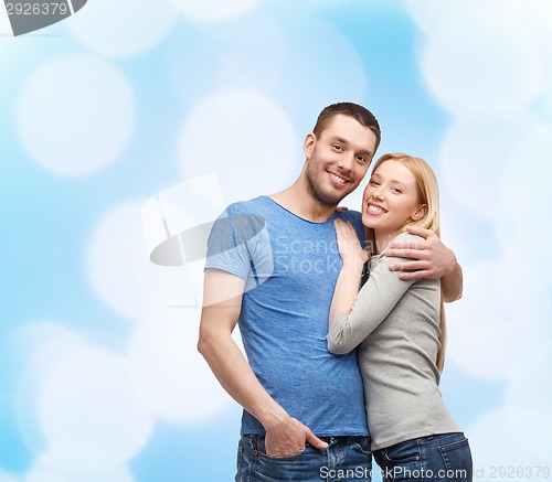 Image of smiling couple hugging