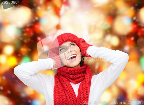 Image of smiling young woman in winter clothes