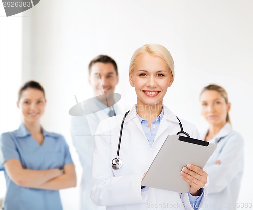 Image of female doctor with stethoscope and tablet pc